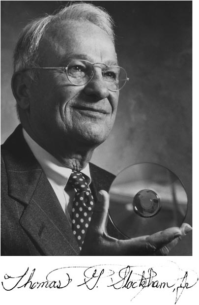 Thomas G. Stockham, Jr. holding a CD